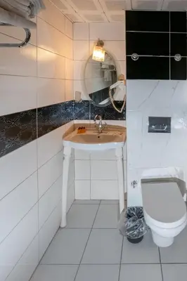 a bathroom with a sink and a toilet at The Center Hotel in Istanbul
