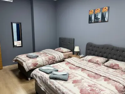 a bedroom with two beds with towels on them at Nur Sena's House in Istanbul