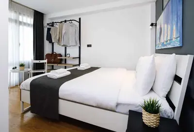 a bedroom with a large white bed with white pillows at Monnas Bosphorus in Istanbul