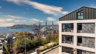 an apartment building with a view of the water at Monnas Bosphorus in Istanbul