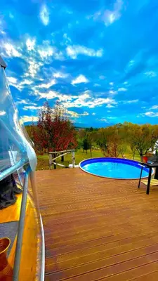 a swimming pool sitting on top of a wooden deck at Sapanca Green Dome in Sapanca