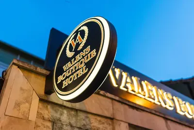a sign on the side of a building with a vanguard squirrel soup sign at Valens Boutique Hotel in Istanbul