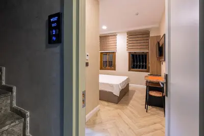 a bedroom with a bed and a desk in a room at Valens Boutique Hotel in Istanbul