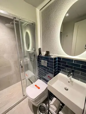 a bathroom with a toilet and a sink and a mirror at Ayramin Exclusive Hotel - Special Category in Istanbul