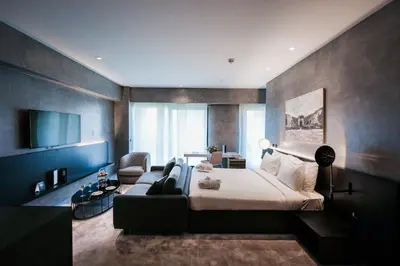 a hotel room with a bed and a couch at The Mill Bomonti in Istanbul