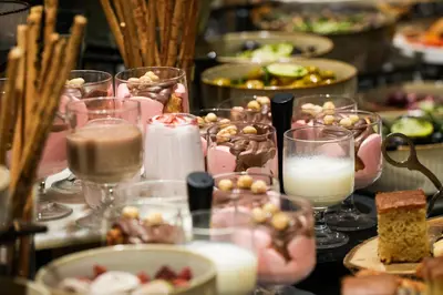 a table topped with glasses of food and desserts at The Mill Bomonti in Istanbul