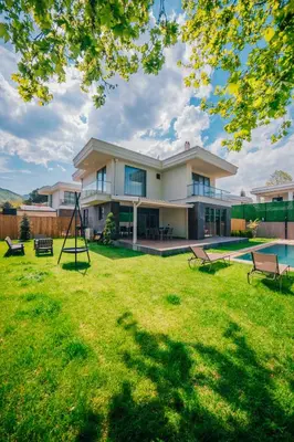 a large house with a yard with a pool at New Balturk Villas Sapanca in Sapanca