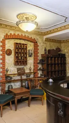 a room with a table and chairs in a room at Istanbul Irish Hotel in Istanbul