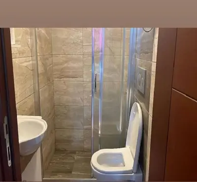 a bathroom with a toilet and a sink at Taksim Soushian Hotel in Istanbul