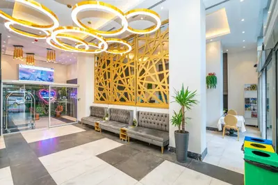 a lobby with couches and a large chandelier at The Gate Kadıköy Downtown in Istanbul