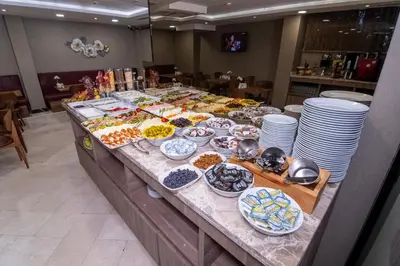 a buffet of food on a table in a restaurant at The Omiya Hotel in Istanbul