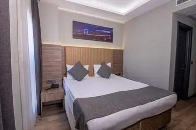 a bedroom with a large bed in a room at The Omiya Hotel in Istanbul