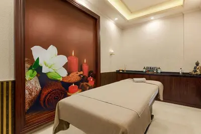 a room with a bed and a painting of flowers at Ramada Plaza by Wyndham Silivri in Silivri