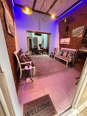 a living room with a couch and a table at Elegance Aparts Cihangir in Istanbul