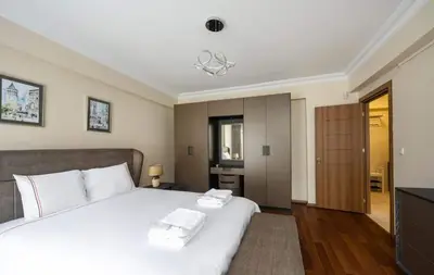 a bedroom with a white bed with white towels on it at Lovely bright central modern 1Bed1Bath! #159 in Istanbul