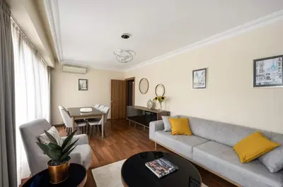 a living room with a couch and a table at Lovely bright central modern 1Bed1Bath! #159 in Istanbul