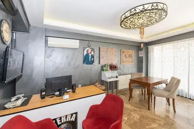 a living room with a dining table and a television at Terra Apart Taksim in Istanbul