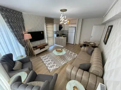 an overhead view of a living room with couches and a television at King Suite ZG5 in Esenyurt