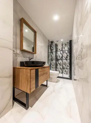 a bathroom with a sink and a toilet at Hexa Suites Hotel in Istanbul