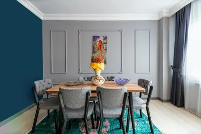 a dining room table with chairs and a vase on it at Hexa Suites Hotel in Istanbul