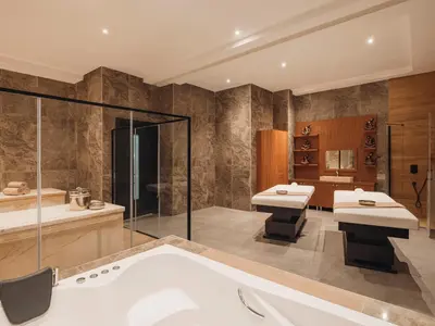 a bathroom with a tub and two sinks and a shower at Selectum City Ataşehir in Istanbul