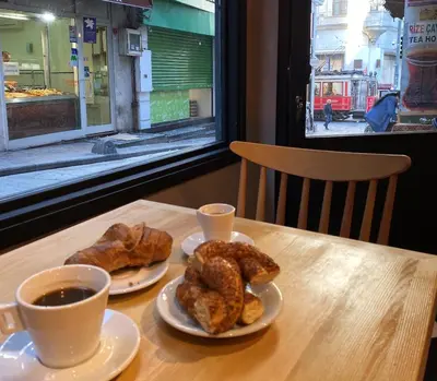 a table with two cups of coffee and pastries at Li Hotel Pera in Istanbul
