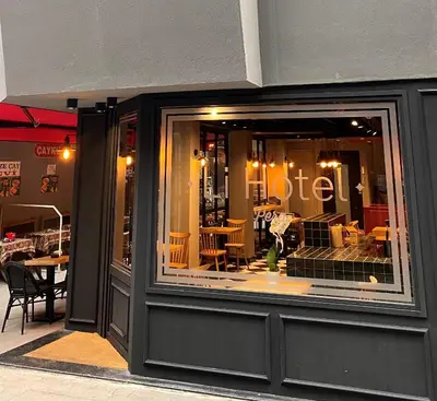 a window of a restaurant with tables and chairs at Li Hotel Pera in Istanbul