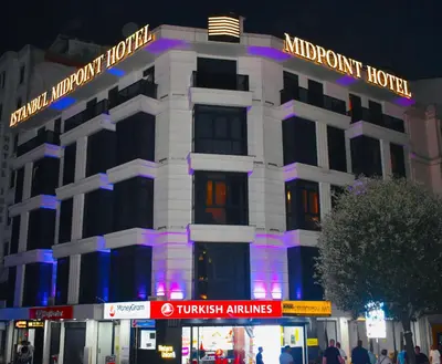 a white building with a sign on top of it at Istanbul Midpoint Hotel in Istanbul