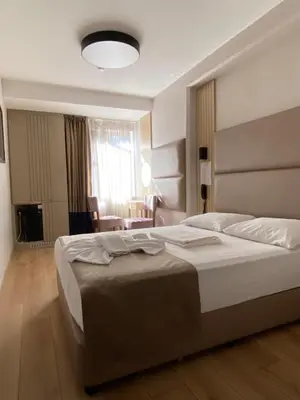 a bedroom with a large bed in a room at Otel Yenikapı in Istanbul