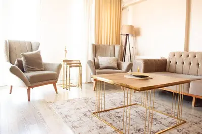 a living room with a table and two chairs at Deluxe King Suite AS3 in Esenyurt