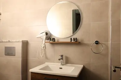 a bathroom with a sink and a mirror at BRANDROOM HOTEL in Istanbul