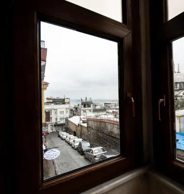 a window with a view of a parking lot at Sultanahmet Black Pearl Apart Hotel in Istanbul