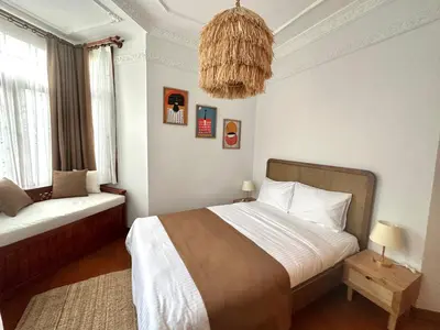 a bedroom with a bed and a chandelier at Botter Dream House in Istanbul
