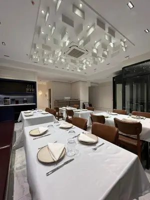 a dining room with white tables and chairs at Prime Bosphorus Hotel in Istanbul