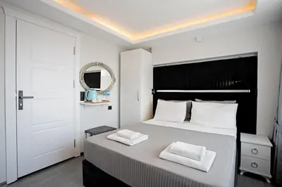 a bedroom with a bed with two white towels on it at Carvan hotel in Istanbul