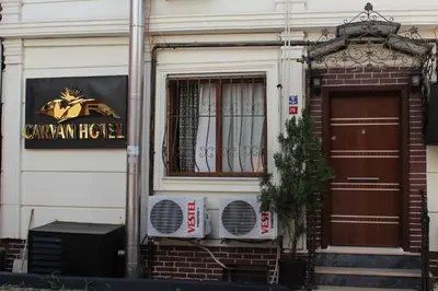a building with a sign on the side of it at Carvan hotel in Istanbul
