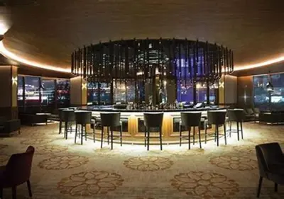 a bar with chairs and a large chandelier at Prime Istanbul in Istanbul