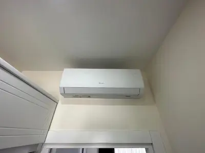 a white air conditioner in a room with a ceiling at Rose Plus Residence in Istanbul