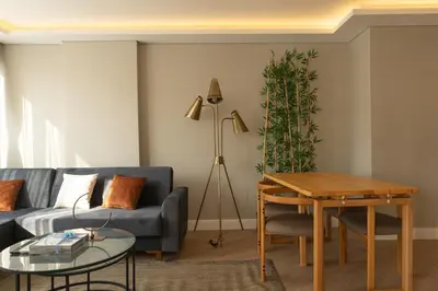 a living room with a couch and a table at Bolahenk Suites in Istanbul