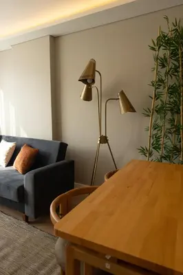 a living room with a couch and a table at Bolahenk Suites in Istanbul
