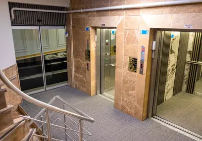 a lobby with two elevators in a building at ZOOM HOTEL in Istanbul