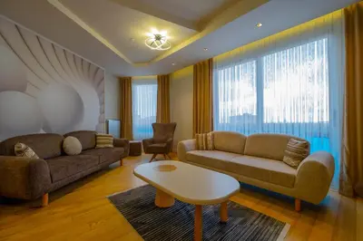 a living room with two couches and a table at Ar-mo-ni in Istanbul