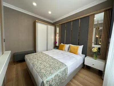 a bedroom with a large bed and a window at H&L Suites in Istanbul