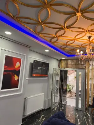 a room with a ceiling with a painting on it at Sami hotel in Istanbul