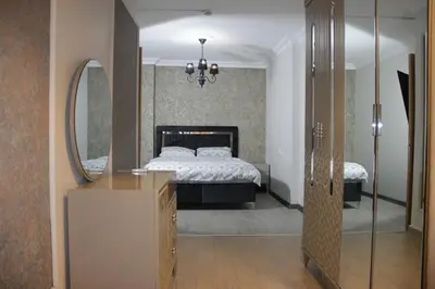 a bedroom with a bed and a mirror at Solo Suites Hotel in Istanbul