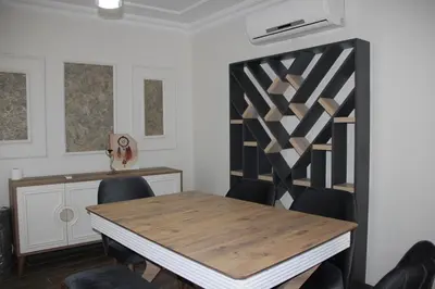 a dining room with a wooden table and chairs at Solo Suites Hotel in Istanbul
