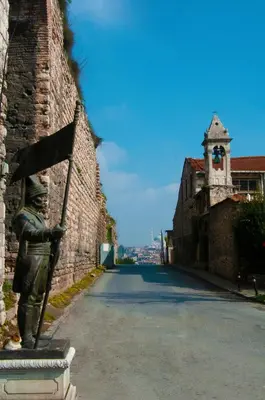 a statue of a man standing on the side of a street at İstanbul Efes Hotel in Istanbul