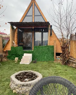 a house with a fire pit in the yard at Yalova Kasaba Bungalov in Çınarcık