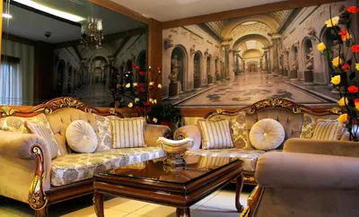 a living room with two couches and a painting at GROSS HOTEL in Istanbul