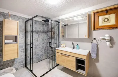 a bathroom with a shower and a sink at Villa Base Kırkpınar Detached Villa with pool in Sapanca